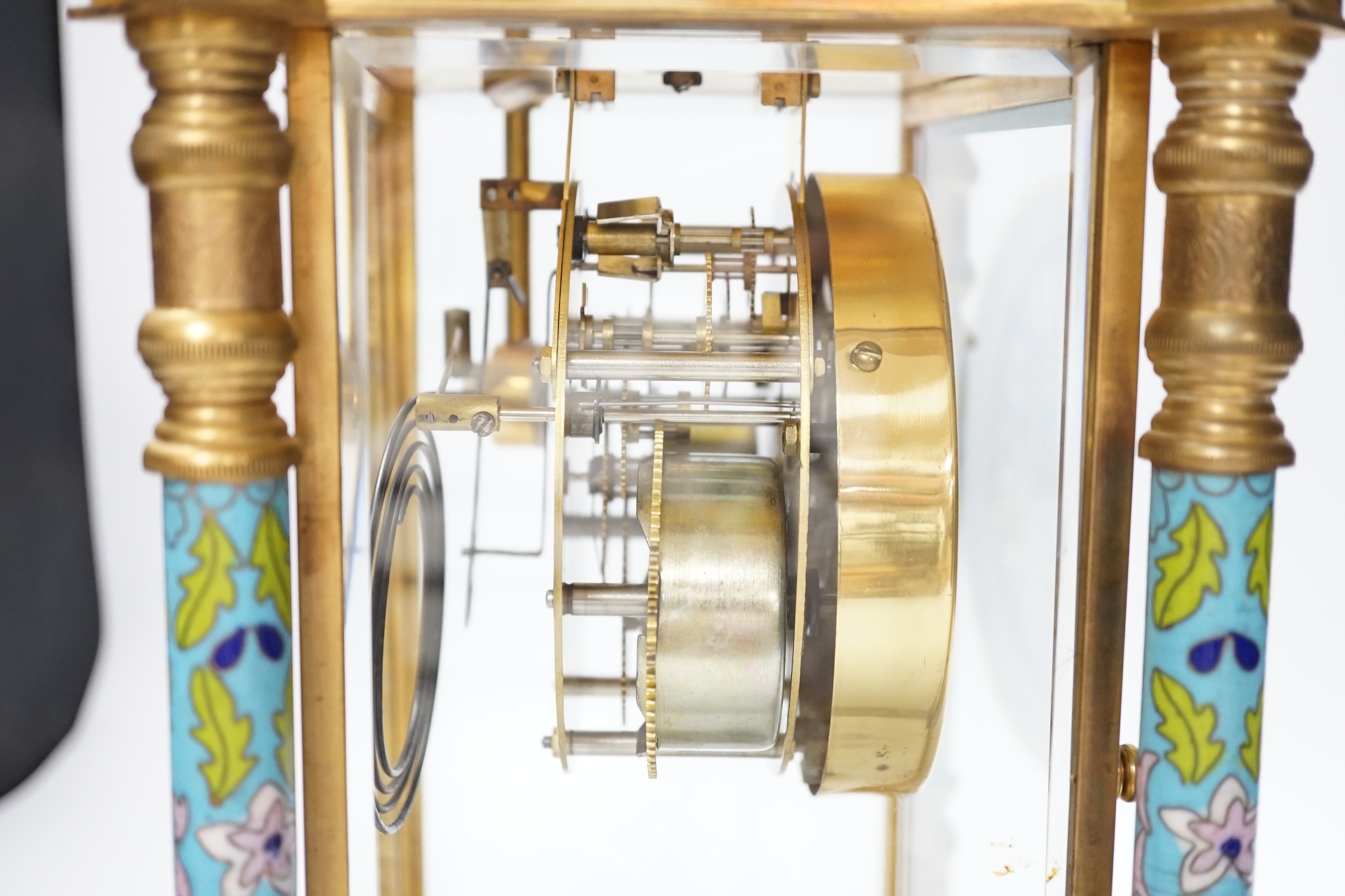 A champlevé four glass and brass mantel clock, with enamel dial, 45cm high